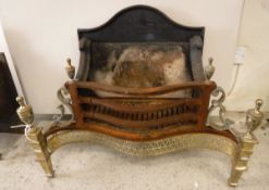 A modern cast iron and brass fire basket in the Regency taste