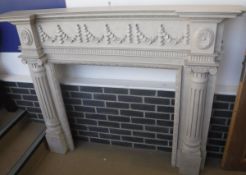 A modern painted oak fire surround in the 19th Century style
