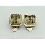 A pair of 14 carat gold mounted citrine clip-on earrings of square form,