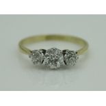 A 9 carat gold three stone diamond set ring, approx 1 carat total,
