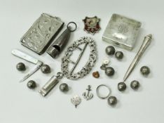 A collection of silver and plated wares to include two whistles, one of curved tapering form,