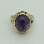 A 14 carat gold dress ring set with oval cabochon cut amethyst CONDITION REPORTS The