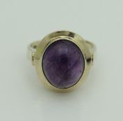 A 14 carat gold dress ring set with oval cabochon cut amethyst CONDITION REPORTS The