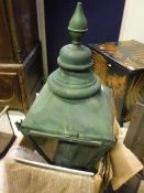 A circa 1900 painted metal street light of typical lantern form with wall mount,