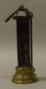 A mid 19th Century un-named Newcastle type miner's lamp with brass mounts and three iron rods