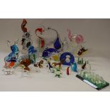 A collection of various coloured glass animal ornaments,