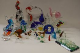 A collection of various coloured glass animal ornaments,