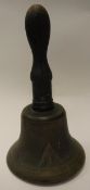 A War Department handbell, three brass shell cases, a modern brass miniature milk churn,