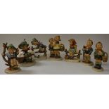 A collection of seven small Goebel Hummel figures of children including "To market" "Retreat to