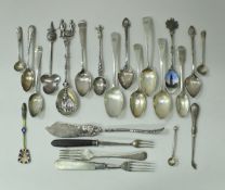 A collection of silver to include teaspoons, mustard spoons, forks, etc,