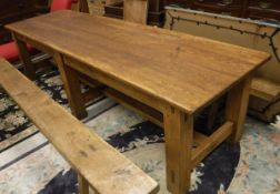 A 19th Century Irish pine school table the four plank top above a plain frieze on six square