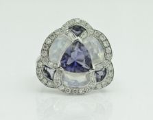 An 18 carat white gold iolite moonstone and diamond dress ring of stylised cluster form by Isabelle