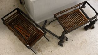 A pair of modern wrought iron fire baskets and a pair of fire dogs