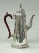 An Elizabeth II silver coffee pot of large proportions in the Queen Anne taste (by T Hill,