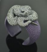 A purple dyed shagreen silver and crystal set bangle in the form of a rattlesnake,