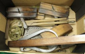 A box of various wood-working tools to include moulding planes, other planes, two small squares,
