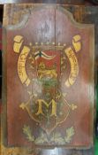 A painted armorial panel inscribed "Globus Concoedia" over the letter "M" with shield depicting