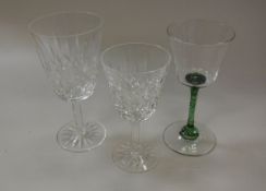 A set of nine Waterford cut glass red wine glasses and a set of nine matching white wine glasses,