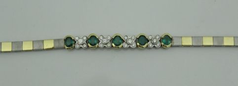 A two tone 18 carat gold emerald set necklace and matching bracelet, total weight approx 51.