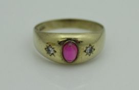 A 9 carat gold cabochon cut ruby and diamond set ring, size U/V,
