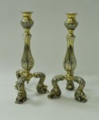 A pair of modern 17th Century style silver gilt candlesticks with acanthus decoration and lion's