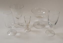 A set of four Dutch green/yellow glass roemers with grape and vine engraved decoration on a fine