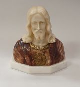 A white and rosso marble carved figural bust of Christ with gilt painted decoration raised on a