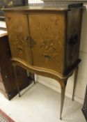 A circa 1900 painted serpentine-fronted cabinet on stand,