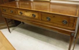 A 19th Century mahogany and satin wood cross banded three drawer side table on square tapered legs