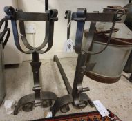 A pair of modern wrought iron andirons with ale mullers and spit holders