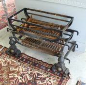 A pair of modern wrought iron fire baskets and a pair of fire dogs