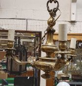 A modern brass three light electrolier in the Rococo style