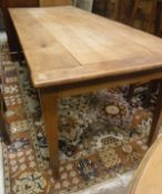 A 19th Century French cherry wood farmhouse kitchen table the plank top with cleated ends over an
