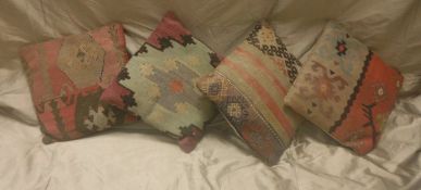 Four Kelim covered cushions