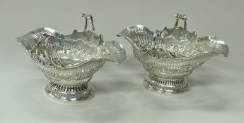 A Victorian silver boat shaped sweet meat dish with scroll handles and pierced main body,