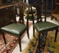 A set of four circa 1900 mahogany Hepplewhite style dining chairs,