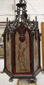 A 19th Century patinated brass framed hall lantern in the Gothic style with frosted painted panels