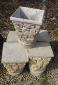 Four modern reconstituted stone finials with dog decoration,