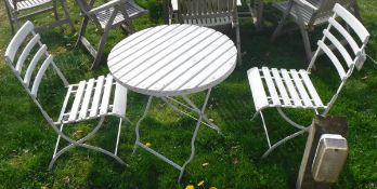 A painted wooden and metal Bistro style garden table and two chairs