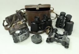 A box containing various binoculars including Carl Zeiss Deltrintem 8 x 30, a pair of Tasco,