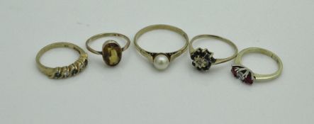 A collection of five 9 carat gold and stone set dress rings