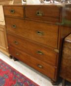 A 19th Century teak and brass bound military / Campaign chest of 2 short over 3 long drawers with