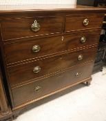 A 19th Century mahogany square front chest of two short over three long graduated drawers on ogee