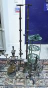 A pair of wrought iron tripod floor standing candle stands, painted pot stand, vegetable rack,