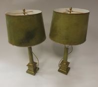 A pair of brass and green speckled leather covered table lamps and shades