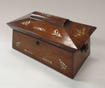 An early 19th Century rosewood and mother of pearl inlaid sarcophagus shaped tea caddy with fitted