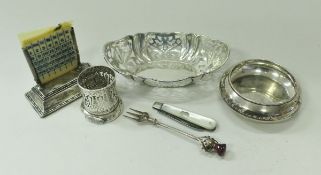 A silver mounted desk calendar, a silver bonbon dish with pierced decoration (by William Comyns,