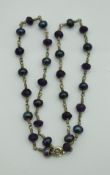 A 9 carat gold haematite and amethyst set necklace