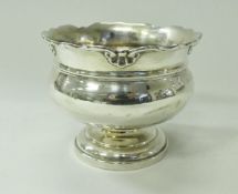 A silver rose bowl of bellied form with pie crust edge,