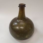 A late 17th Century green glass onion shaped wine bottle CONDITION REPORTS Numerous